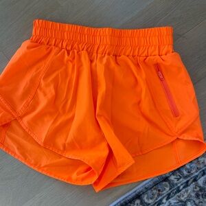 Neon orange athletic shorts